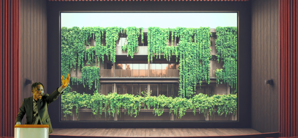 Retorik möter visualisering och stprytelling. En man står på en scen bakom ett podium och talar till en publik. Han har mörkt hår, bär en mörk kostym och lyfter ena armen i en tydlig, utsträckt gest som om han markerar en poäng. Bakom honom fyller en stor presentationsskärm hela scenens bakvägg. På skärmen syns en modern byggnad täckt av hängande grönska och växter, som klättrar längs balkonger och fasad. Scenrummet är mörkt runtomkring, vilket gör att talaren och den gröna bilden bakom honom framträder tydligt.